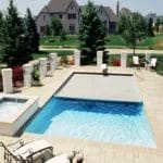 Backyard pool with gray swimming pool cover